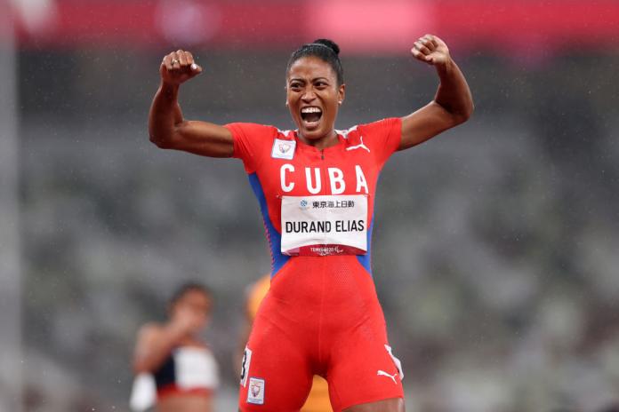 A female Para athlete celebrates after winning her race at the Tokyo 2020 Paralympic Games